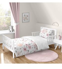 Sealy mattress for crib or toddler bed with bedding