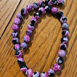 Natural Stone Rose Red Fire Agate 
This is a strand of 33 beads (10MM) 13 inches long. Use as needed for Necklace, Bracelet, Rings, and/or Earrings. 
