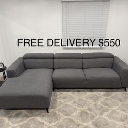 FREE DELIVERY- Grey Living Spaces Sectional Sofa With Adjustable Headrest