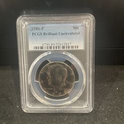 1986 P Brilliant Uncirculated Kennedy Half Dollar Graded By PGCS 5-8
