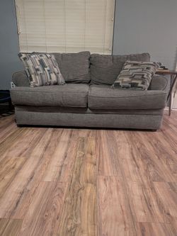 2 Gray Two-Cushion Sofas + Ottoman