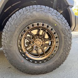 Arena Hustle Smoked Bronze Satin Black Lip Wheels 285|70R17 Falken Wildpeak AT4W Tires Package Deal