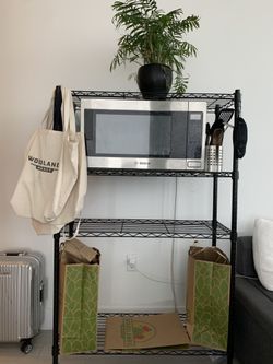 Black shelving storage unit with wheels