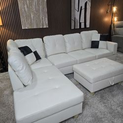 White Leather Sectional Couch And Storage Ottoman