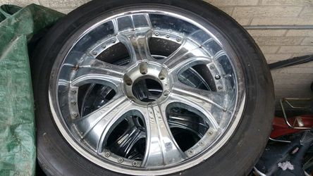 22" inch chrome rims with tires.