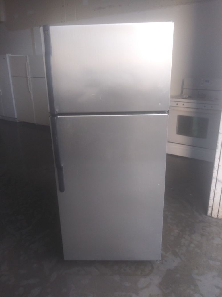 GE apartment size silver stainless steel style refrigerator