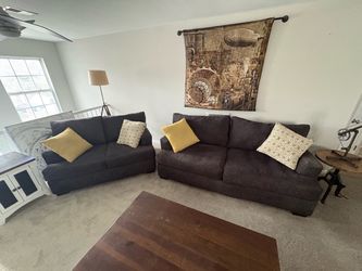 Sofa and love seat with accent pillows