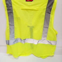 safety vest. Super bright yellow/green color. Has reflective strips all around. Zipper front. Lots of pockets for your stuff, like a clear I