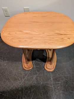Oval Wood Accent Table with Curved Pedestal Base