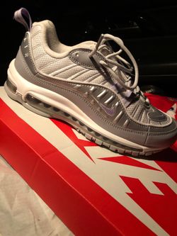 Woman size 9.5 which is a Men 7.5 grey light purple white