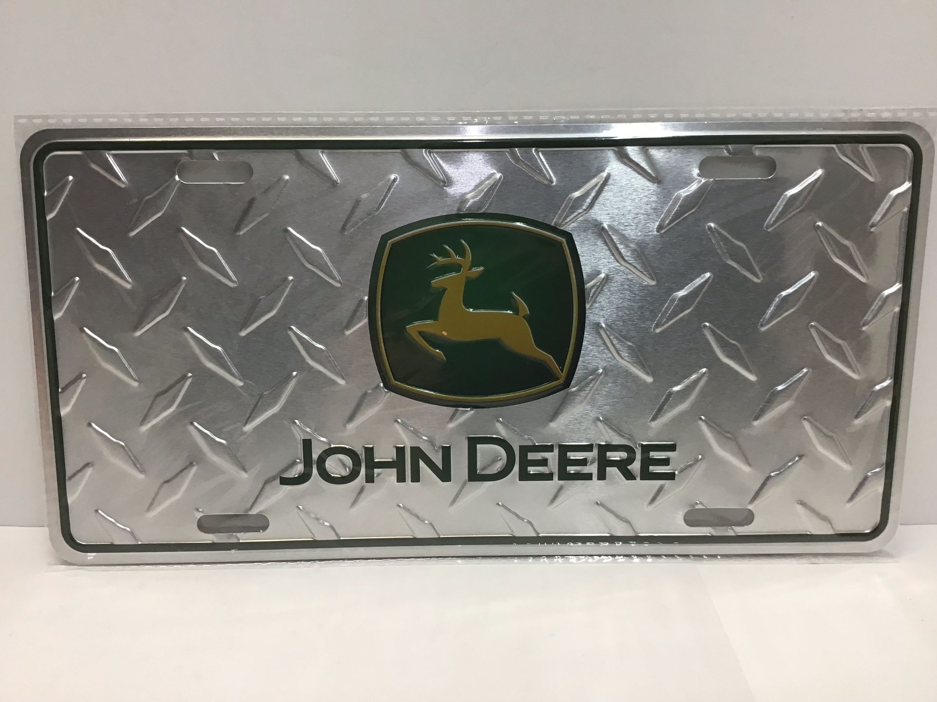 John Deere metal diamond plate, license plate, new sealed. 6”x 12”