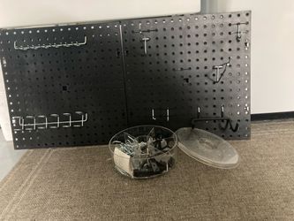 2 tool pegboards with tray of hooks and attachments