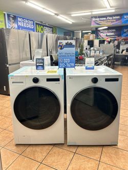  LG 4.5 cu. ft. Stackable Smart Front Load Washer and7.4 cu. ft. Vented Stackable SMART Gas Dryer in White