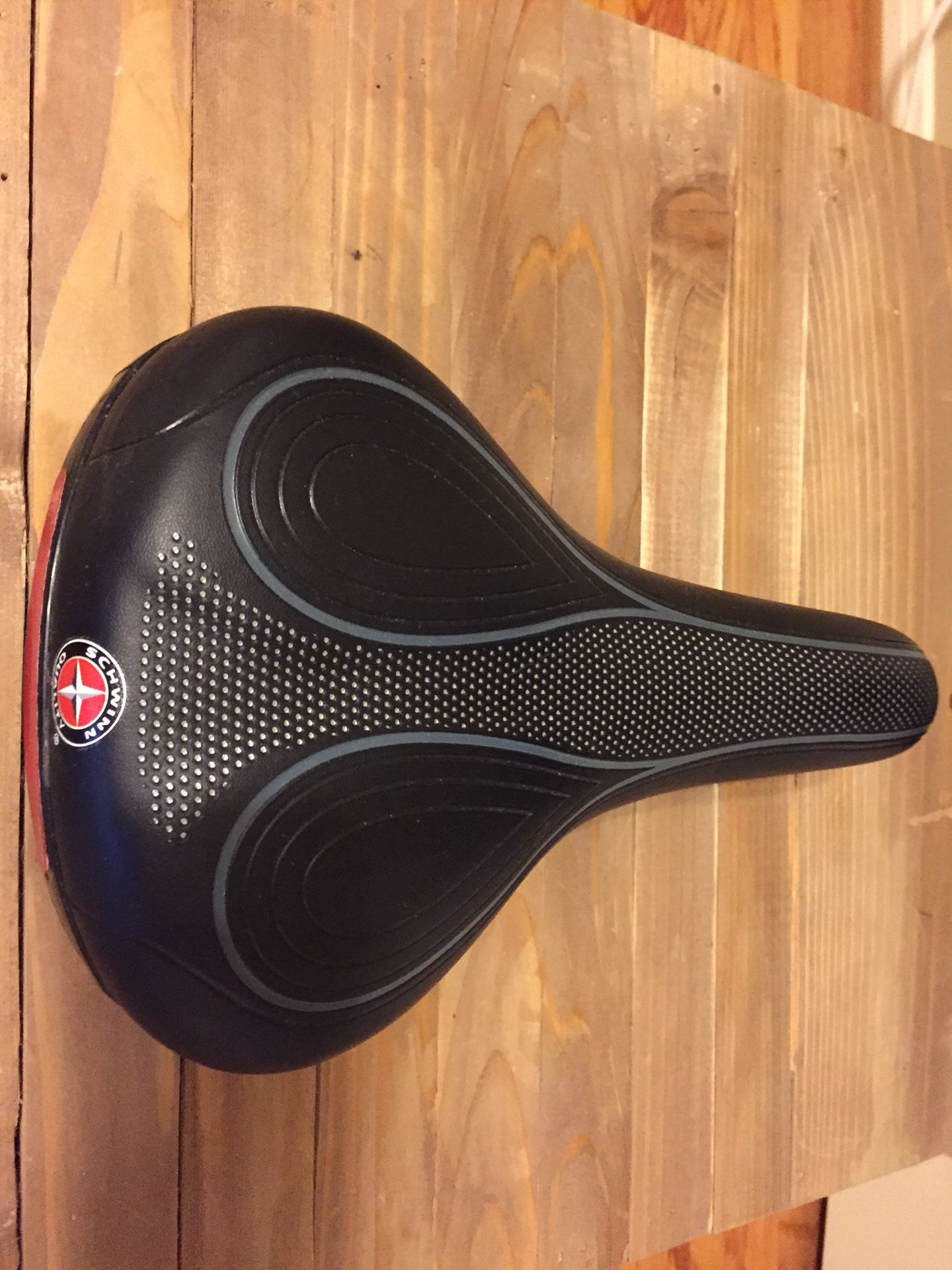 Schwinn bicycle seat with mounting bracket. Perfect condition never used.