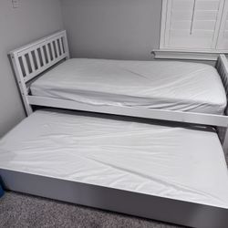 Pair of matching trundle twin beds