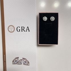 These HaloMoissanite Screw Back Solitaire Stud Earrings feature a lab-created white moissanite as the main stone, set in sterling silver with a 14K wh