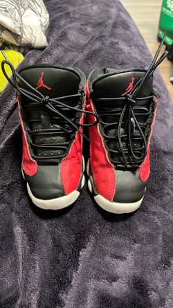 Nike Air Jordan 13 Retro Low sneakers in the "Very Berry" colorway, featuring a black and red upper with white soles. size 12c