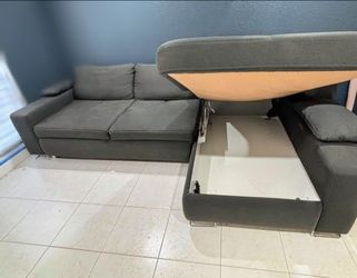 Free Delivery Today! Beautiful! Cleaned Lounge style sectional with storage chaise and pullout bed . Adjustable backrest. Very large. Comfortable! No 
