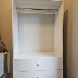 White wall mounted closet with drawers