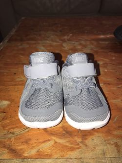 Grey and white baby nikes size 2c for the low