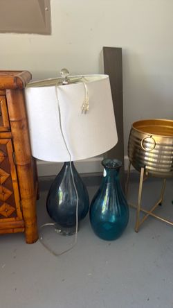 Blue glass lamp and vase