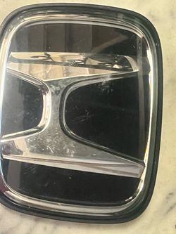 genuine OEM front grille emblem for a Honda CR-V