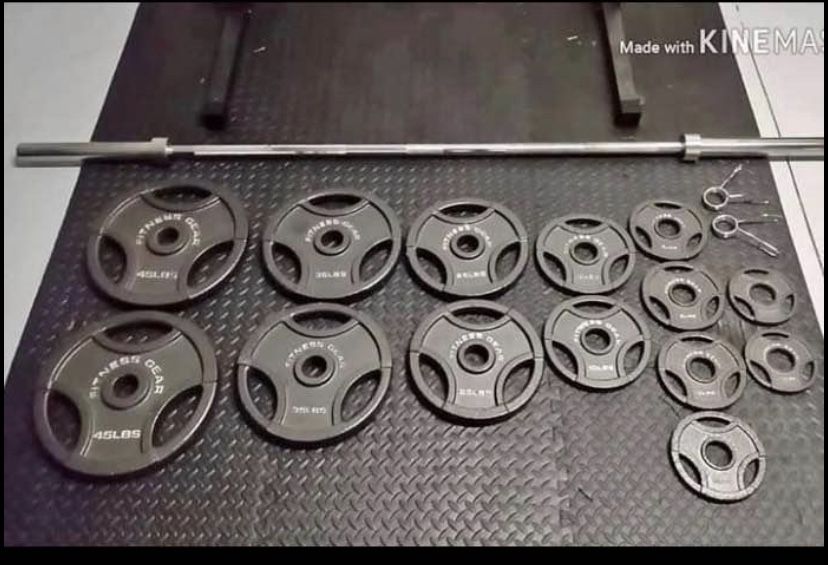 Olympic weight set with bar and clips.