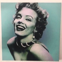 Iconic canvas print of Marilyn Monroe 24 x 24. Has a cool pop art vibe with a teal background. Looks great on any wall.  Pickup in the area of 36th Av