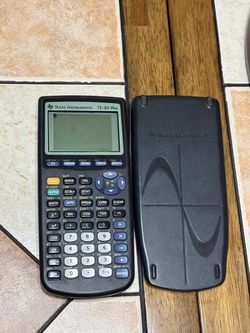 Texas Instruments TI-83 Plus calculator with case