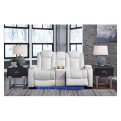 White leather Loveseat 2 recliners, with center storage console and 2 cup holder's 