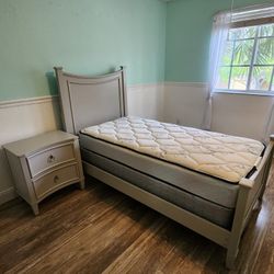 Twin bed with mattress and nightstand 