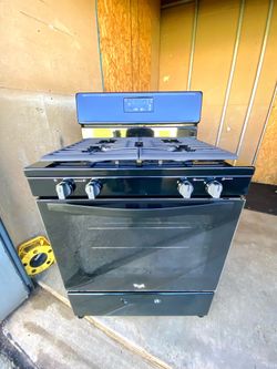 Whirlpool gas stove 4 burners  black color.  30”