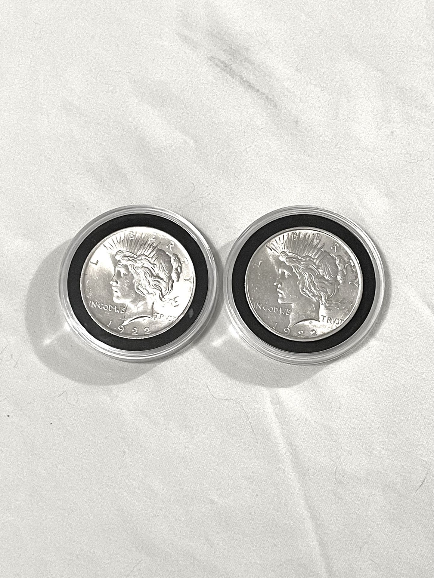 Uncirculated-MS(60)  1922 Piece Silver Dollars Sealed In Cases. These Are Valued $88 Each On Us Coin Book. I’ll Take $75 Each. $150 for both.