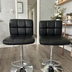 Set of 2 Black Faux leather Swivel Bar Stools with a chrome finish base $ 35 for both 