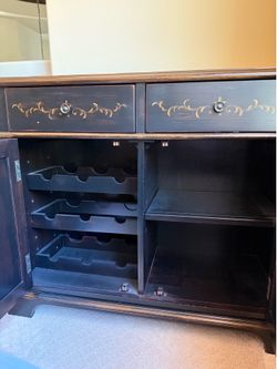 Dark brown wood cabinet 32in. H x 38 1/8in W x 16 D