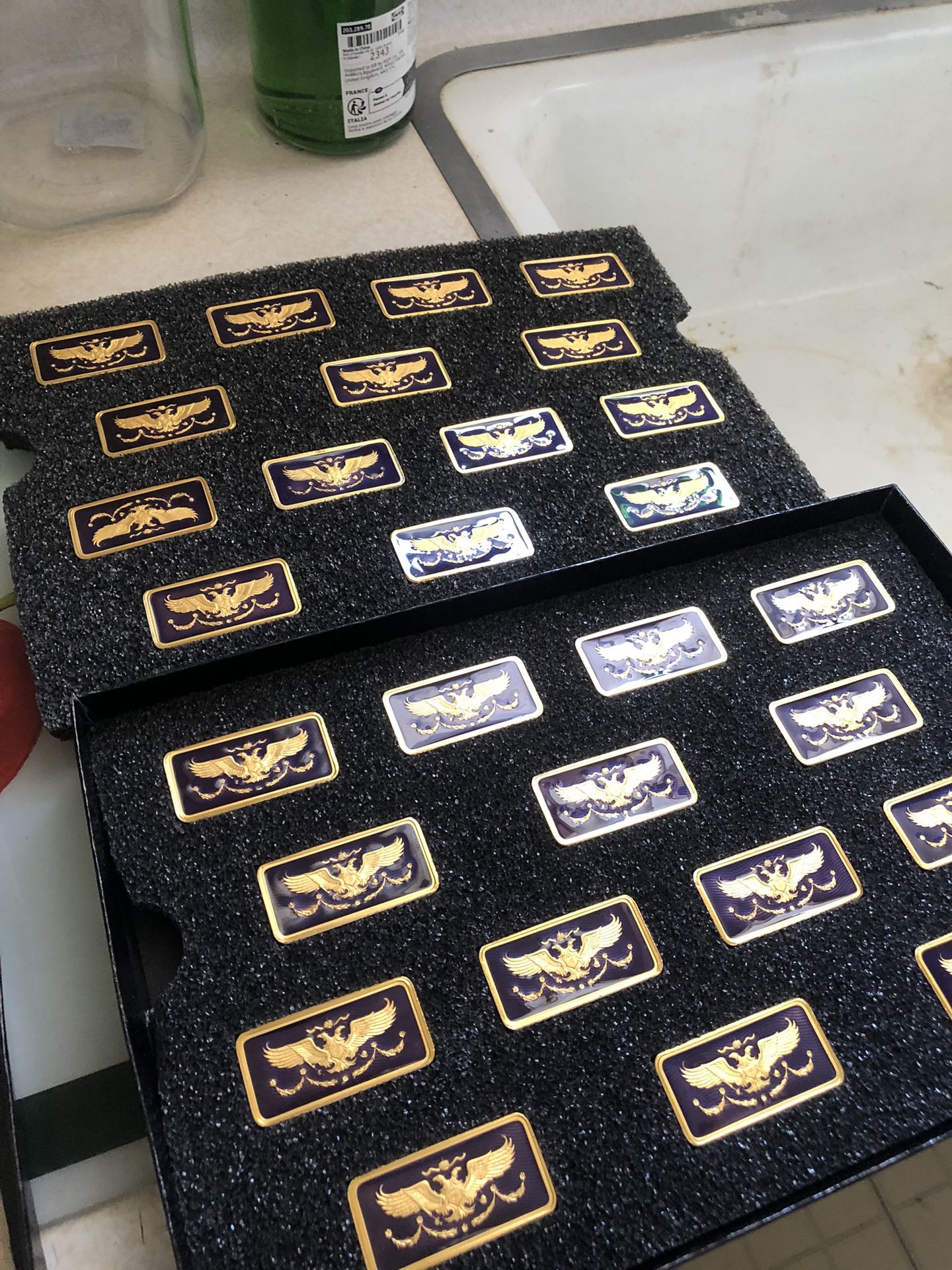 Franklin Mint, Imperial Dominoes by House of Fabergé. Set has 28 individually minted dominoes in 22K gold plate with blue guilloche enamel featuring t