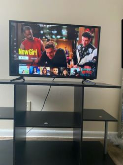 32" Sanyo Smart TV with a stand.