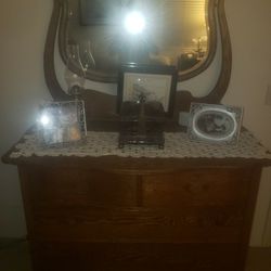 Antique dresser with attached mirror