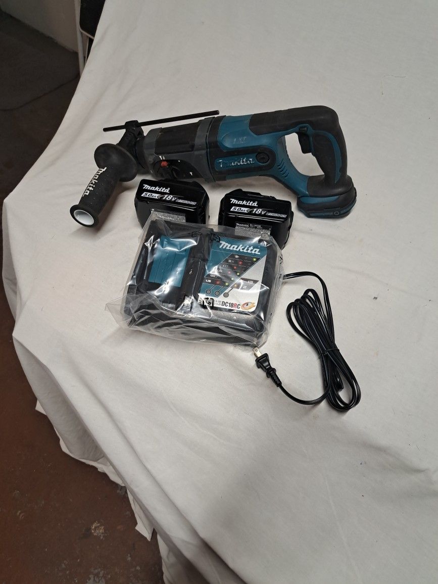 Makita 18 V roto hammer with Two5.0 AH batteries and charger.