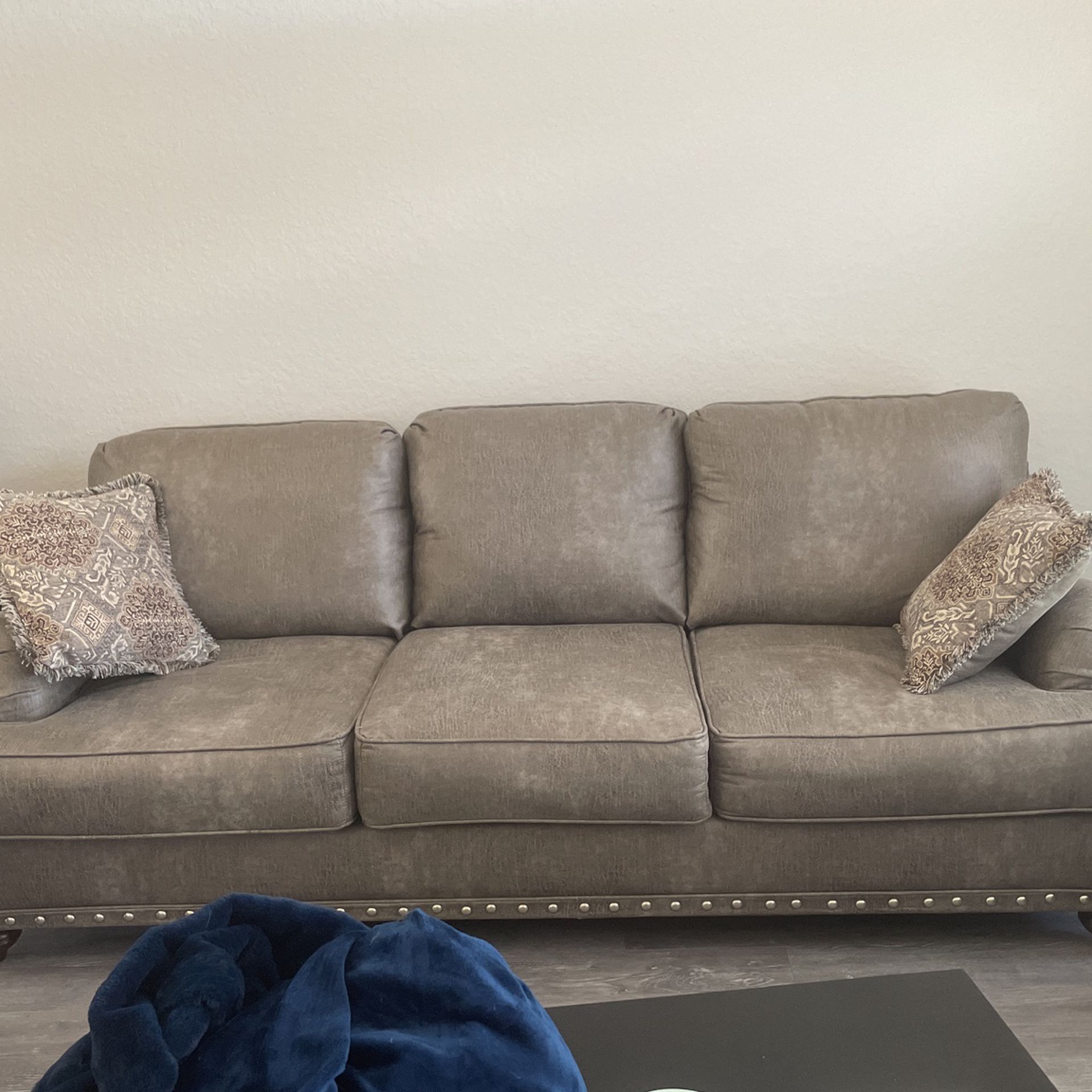Sofa And Loveseat With Pillows On Both