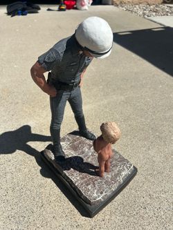 Antique statue police officer and kid