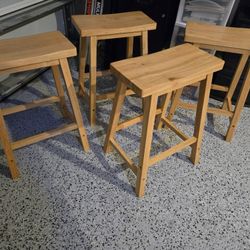 (4) Wooden Counter/Bar Stool made in Malaysia.   They only had  a few months of use.  We changed to chairs with a back.