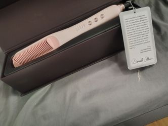 Wavytalk Steamline Pro straightening brush in pink.