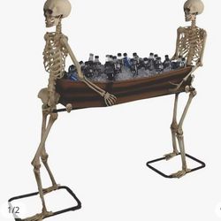 Skeletons holding coffin