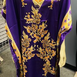 • Beautiful Purple Floral Kaftan C Elegant and comfortable kaftan dress with stunning gold and orange floral design. The soft fabric and loose fit mak