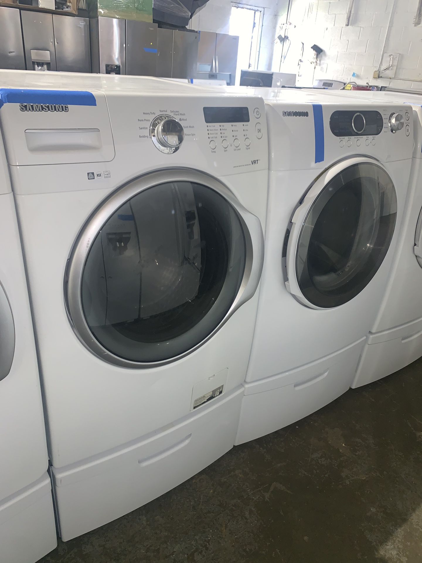 Samsung front load washer & electric dryer with pedestals in excellent conditions with 4 months warranty