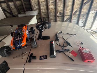 powered  Jato 3.3 RC car gas powered it has 2.5k modifications on it and parts orange color max speed if u push its 100mph