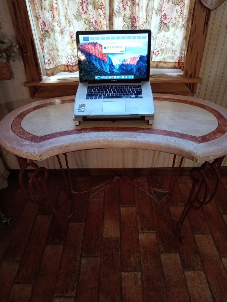 Table with decorative iron legs