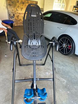Teeter for back pain relief