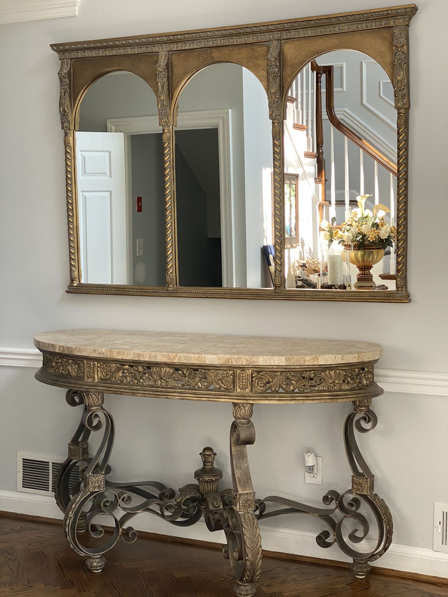 Set of faux marble console and cast iron mirror